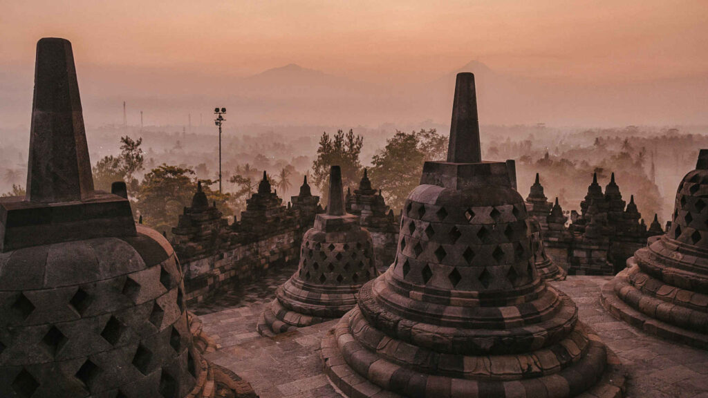 View overlooking Borobudur, the largest Buddhist temple complex in the world - in Jogyakarta region, Indonesia.
