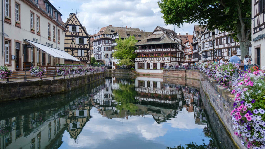 View of waterways and traditional architecture in Strasbourg, France.
  