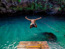 A youth jumping into the waters of the Tu Sua Ocean Trench in Samoa.