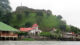 View of El Castillo from the water on a cloudy day, Nicaragua.